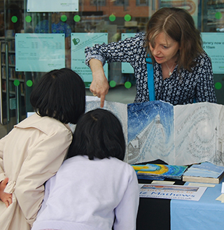 Liz with some young visitors to the exhibition.
