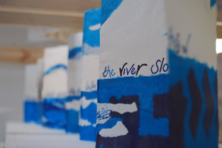 Inside the central cabinet: concertina books including Watermusic (text by Elizabeth Jennings); Looking through (text by Alice Oswald); Stream (text by William Blake)